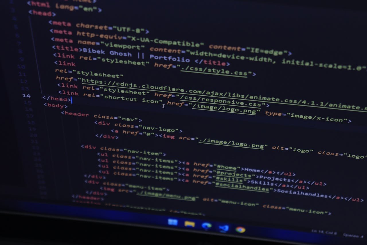 High-resolution close-up of HTML code displayed on a computer screen, perfect for technology themes.